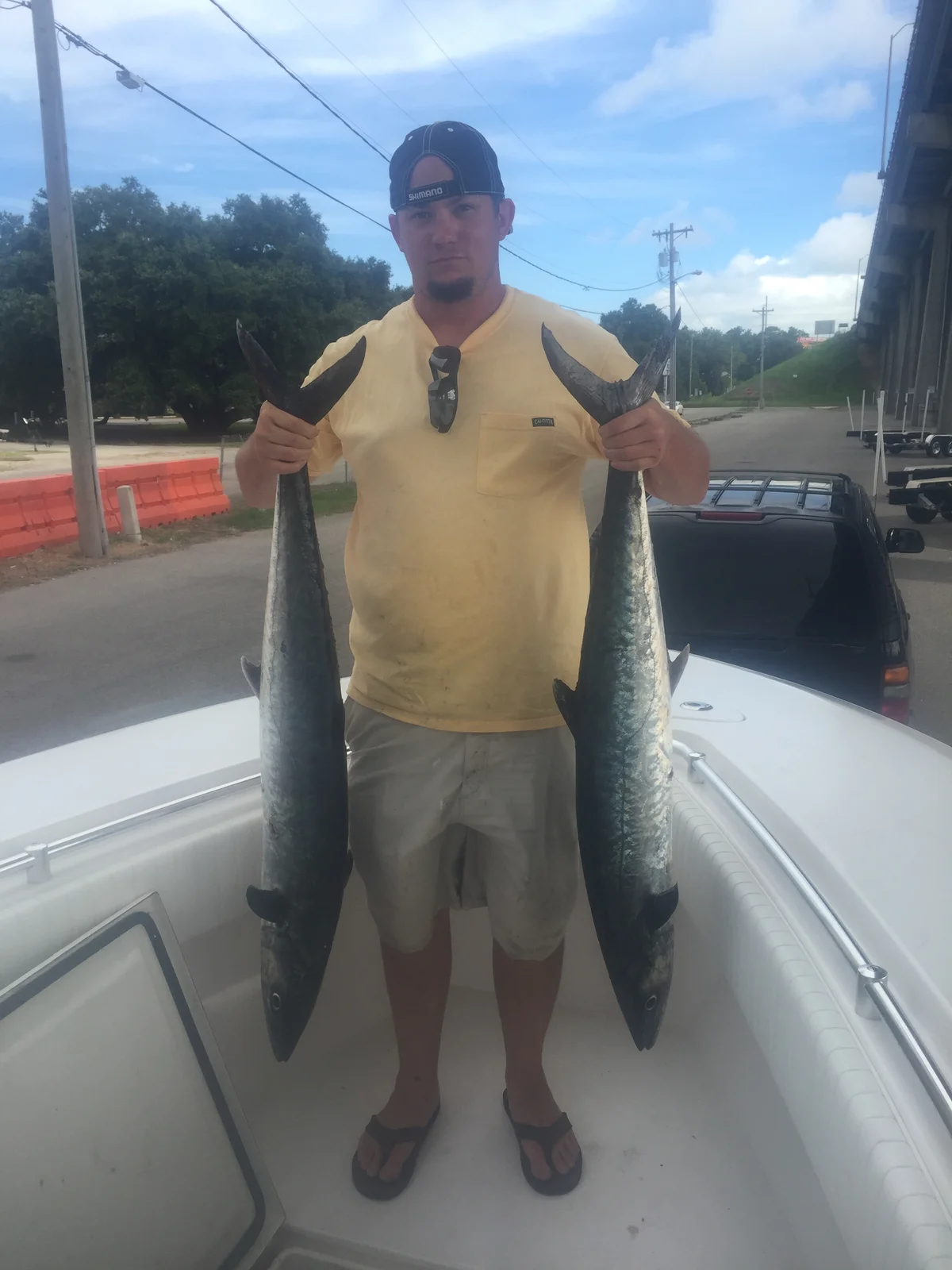 A pair of king mackerel at the ramp after a day rigging dead and live bait